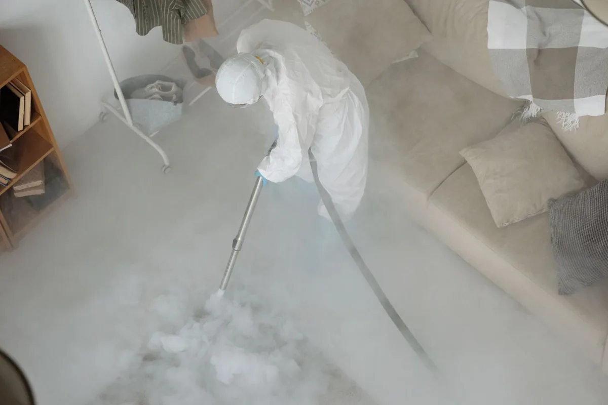 Biohazard cleanup technician in protective equipment, Delano, Wichita, KS